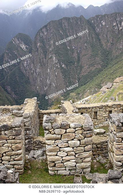 Detail of the ruins of Machu Picchu with a view of the mountain