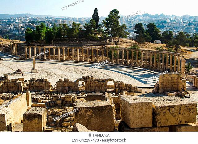 Photo of the Archaeological Site, park of Jerash. Oval Plaza and ruins sanctuary of Zeus Olympios. Tourism industry, sightseeing concept