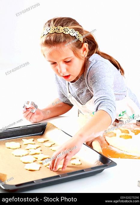 Cute girl baking cookies