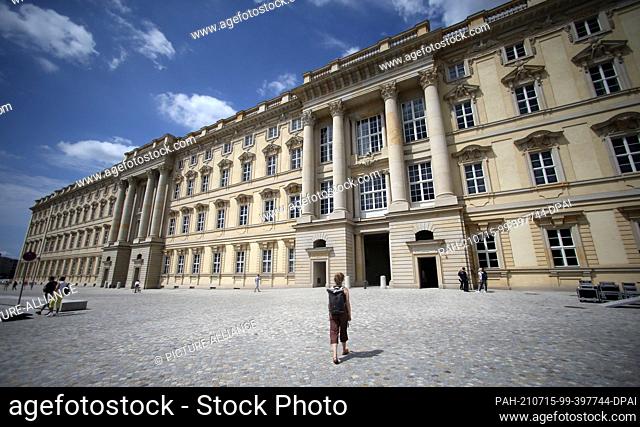 15 July 2021, Berlin: People go to the Humboldt Forum. The rebuilt Berlin City Palace opens on July 20 with several exhibitions