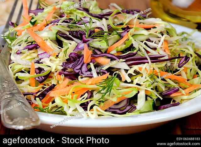 Salad  coleslaw red and white cabbage with carrots and cucumber