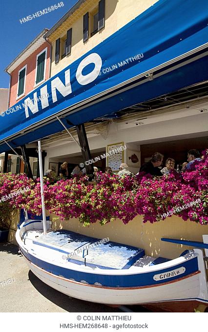 France, Bouches du Rhone, fishing boat locally known as barquette provencale or pointu in Cassis harbour, Nino restaurant