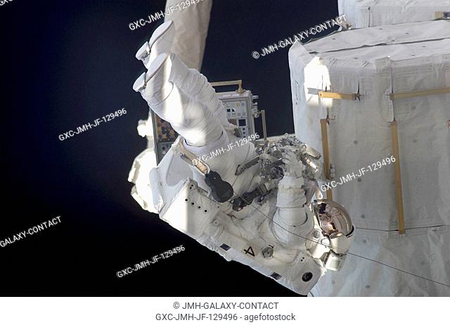 Astronaut Daniel W. Bursch, Expedition Four flight engineer, participates in the five-hour, 47-minute space walk on February 20, 2002
