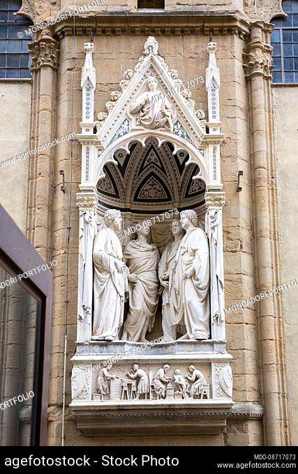 The sculptural group of the Four Crowned Saints by Nanni di Banco in one of the niches of the external tabernacles of the church of Orsanmichele