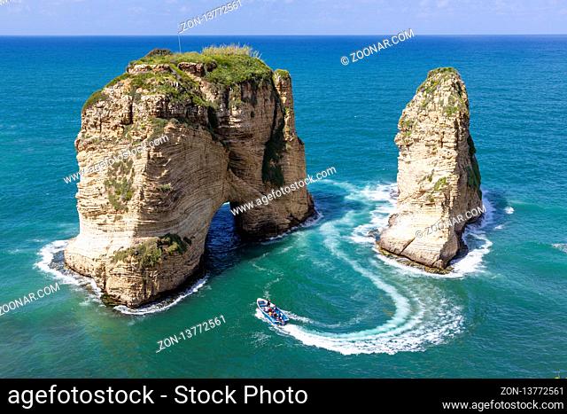 Rouche rocks in Beirut, Lebanon in the sea during daytime. Pigeon Rocks in Mediterranean sea