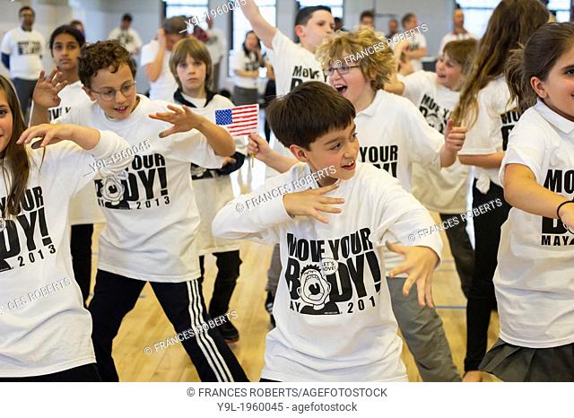 Exercisers participate in the Move Your Body campaign in Avenues The World School in Chelsea in New York. The campaign was launched by the WAT-AAH! Foundation...