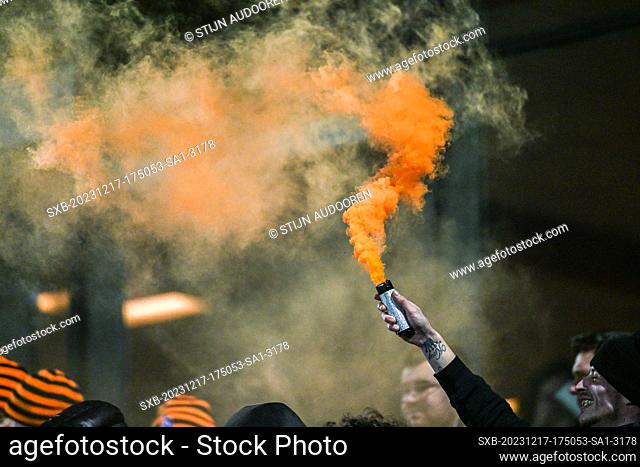 Supporters Deinze - orange smoke pictured during a soccer game between KMSK Deinze and SL16 FC during the 16th matchday in the Challenger Pro League 2023-2024...