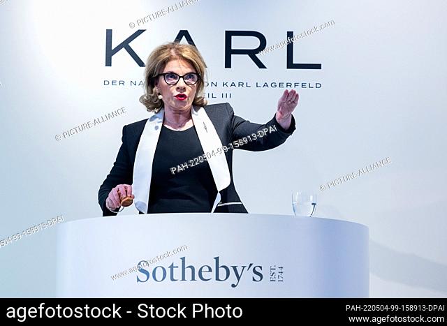 04 May 2022, North Rhine-Westphalia, Cologne: Caroline Lang, auctioneer, acts at the auction of the third part of the estate of fashion designer Karl Lagerfeld...