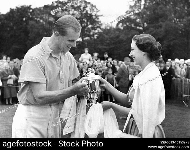 From The Princess To The Duke -- Princess Margaret, in turquoise blue dress and white cardigan, smiles as she present the Duke of Sutherland cup to the Duke of...