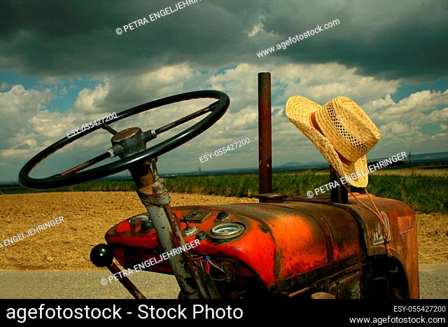 relaxation, recreation, rural scene, tractor, straw hat