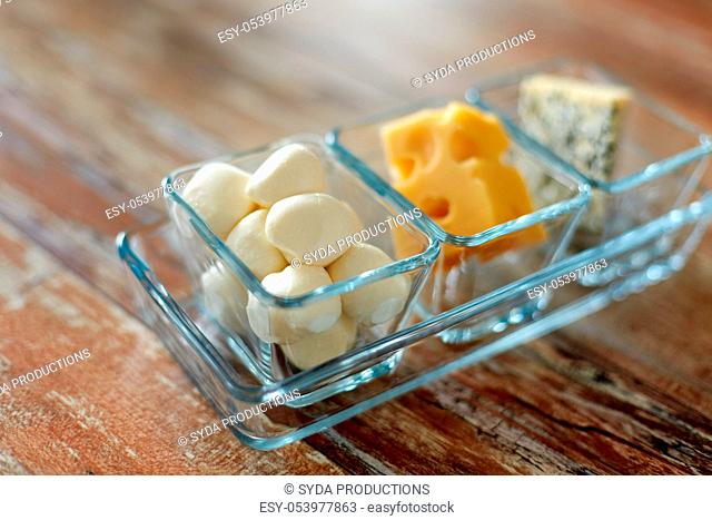 different kinds of cheese in glass cups