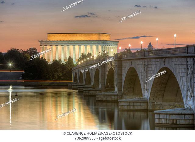 The Arlington Memorial Bridge spans the Potomac River leading to the Lincoln Memorial shortly before sunrise
