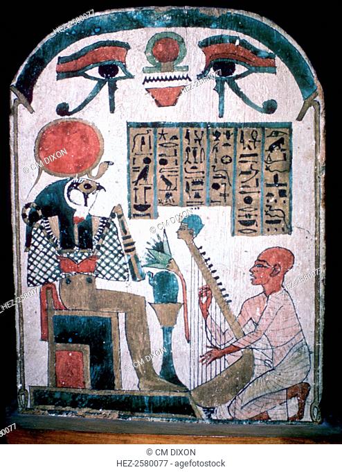 Egyptian funerary slab of Diedkhonsu Soefankh, a musician of Amon. He plays his harp before Re-Harakated. From the Louvre's collection