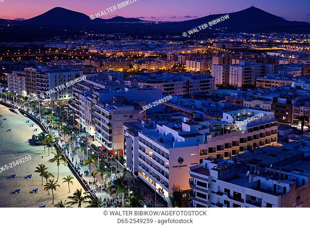 Spain, Canary Islands, Lanzarote, Arecife, elevated city view above Playa del Reducto beach, dusk