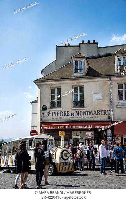 People and tourist train in front of souvenir shop, Place du Tertre, Montmartre, Paris, France