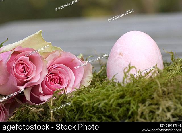 Easter egg with two roses and moss