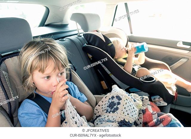 Two boys in car seats