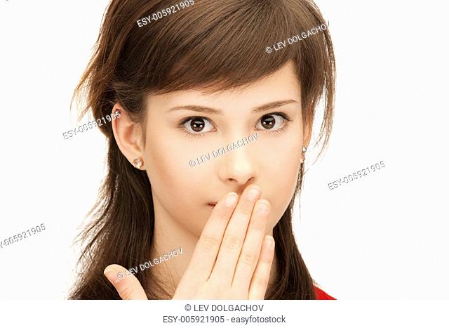 bright closeup portrait picture of teenage girl with palms over mouth