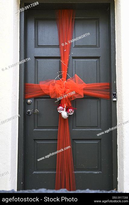 Hjorring, Denmark A big red ribbon on a door to clebrate Christmas