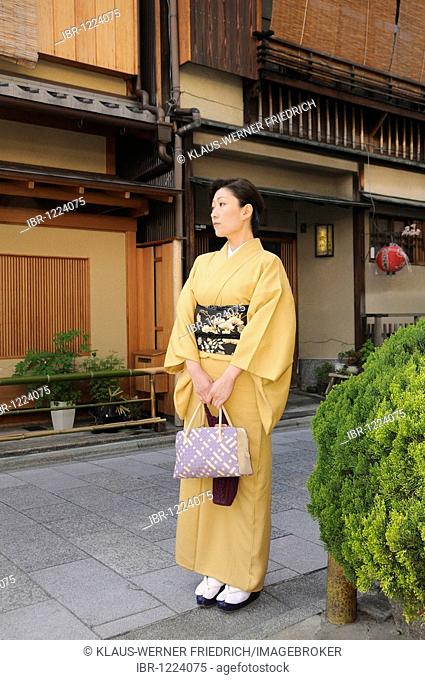 Woman wearing a kimono in a traditional street in the Gion district, Kyoto, Japan, Asia