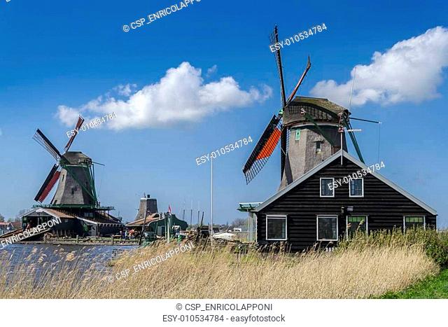 View of two windmills in Zaanse Schans near Amsterdam