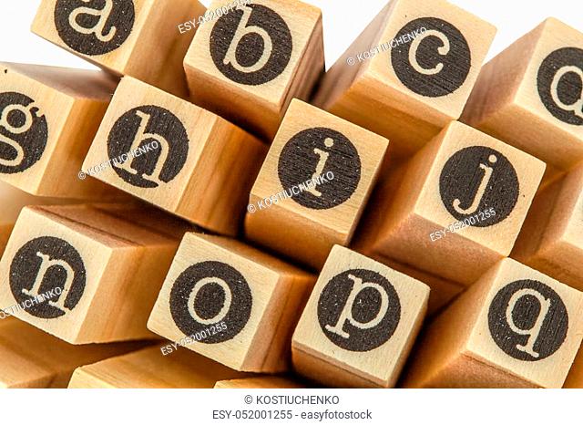 English alphabet lowercase, collage of isolated wood letterpress printing blocks