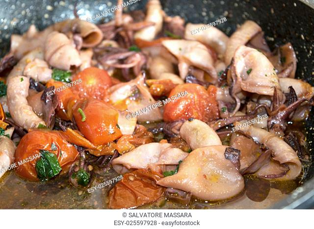 calamari stewed cooked in tomato sauce