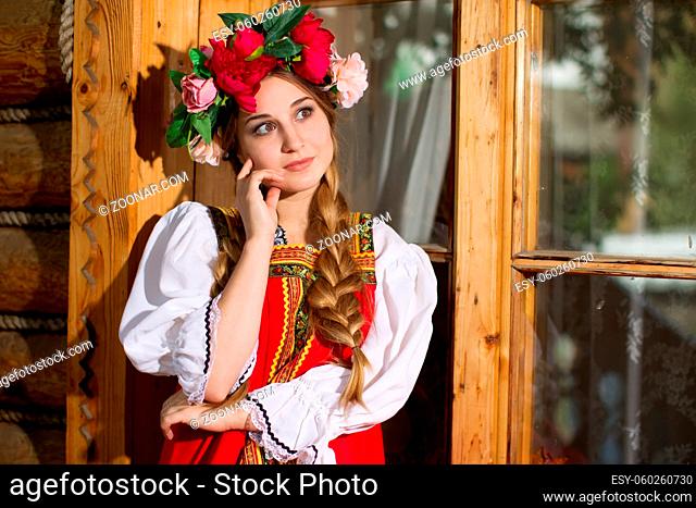 Beautiful woman portrait in russian style. Beautiful Russian girl in traditional dress. Russian style