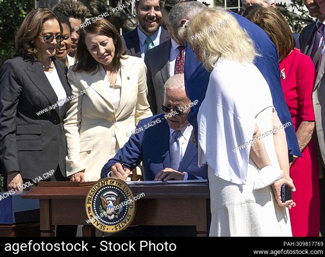 United States President Joe Biden signs into law H.R. 4346, the CHIPS and Science Act of 2022 on the South Lawn of the White House in Washington, DC on Tuesday