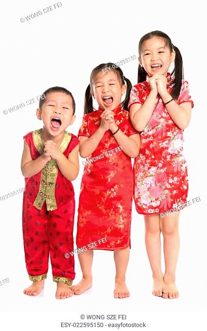 Group of oriental children wishing you a happy Chinese New Year