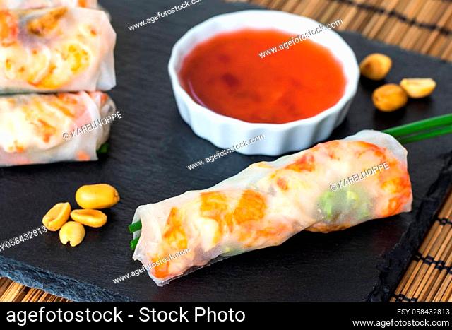 Macro close up of healthy vietnamese shrimp roll with red bittersweet sauce