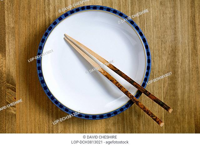 Wales, Monmouthshire, Monmouth. Plate on a table with chopsticks