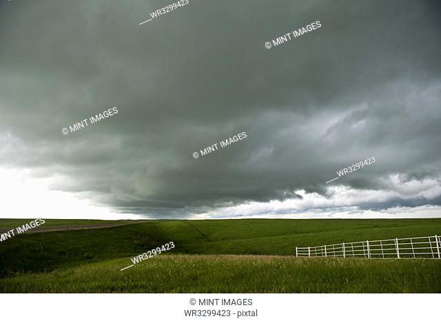 Storm clouds over rural landscape