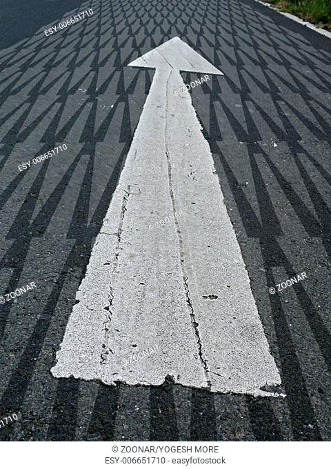 Arrow marked on a highway to show direction