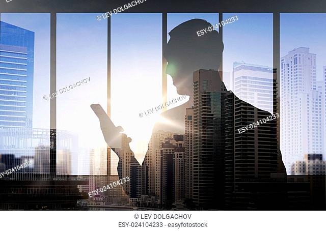 business and people concept - silhouette of businessman with smartphone over double exposure office and city background