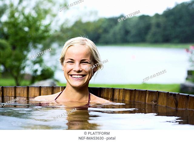 A woman sitting in a bath tub, Sweden