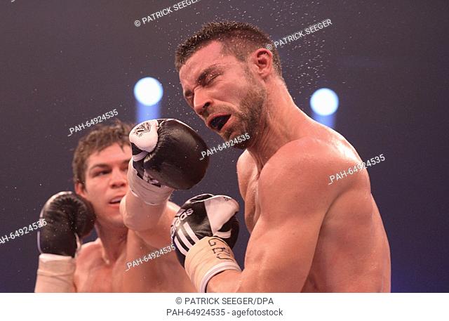 Boxing pros Vincent Feigenbutz (l) of Germany and Giovanni De Carolis (r) of Italy in action during the WBA super-middleweight world championship bout at the...