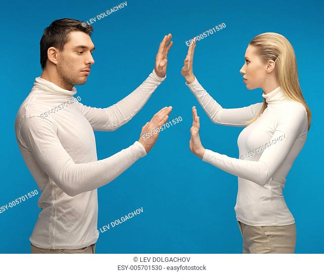 picture of man and woman working with something imaginary