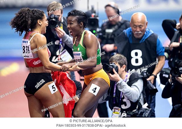 02 March 2018, Great Britain, Birmingham: IAAF World Indoor Championships in Athletics, women's 60m final: Marie-Jose Ta Lou (R) of Ivory Coast and Mujinga...