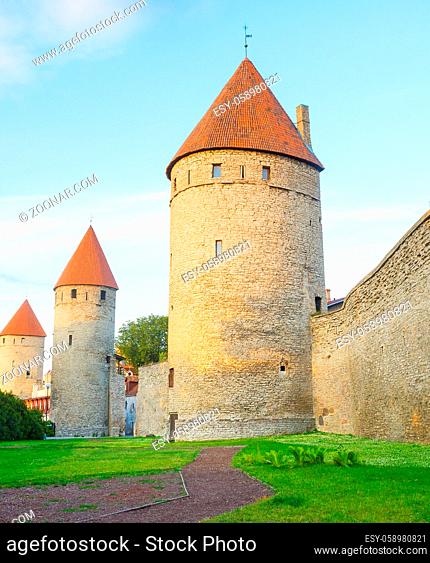 Fortress wall and towers of an Old Town of Tallin in sunset light. Estonia
