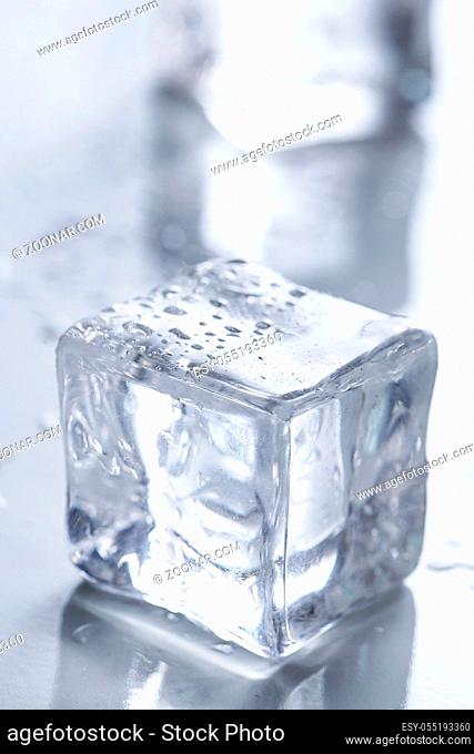 Cold. Frozen ice cubes on the table