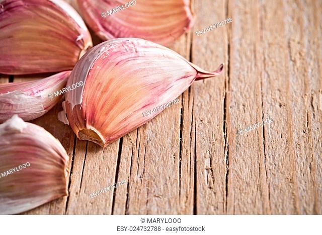 cloves of garlic closeup on wooden table