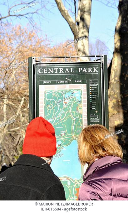 Tourists in front of an information sign, Central Park, Manhattan, New York, USA