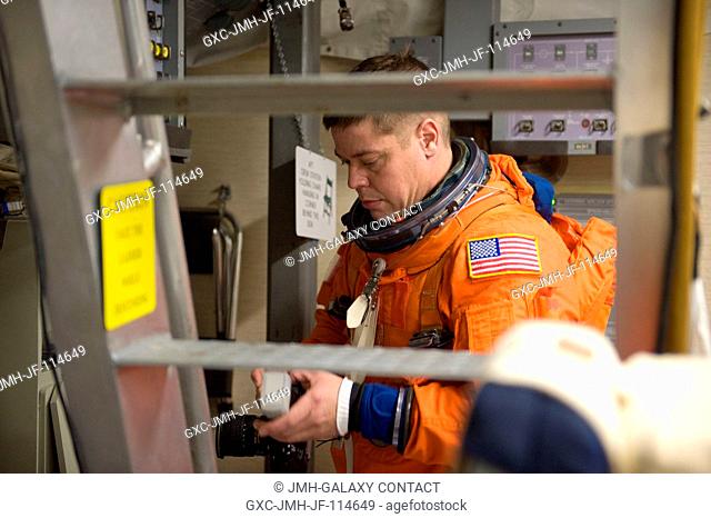 Astronaut Robert Behnken, STS-130 mission specialist, attired in a training version of his shuttle launch and entry suit