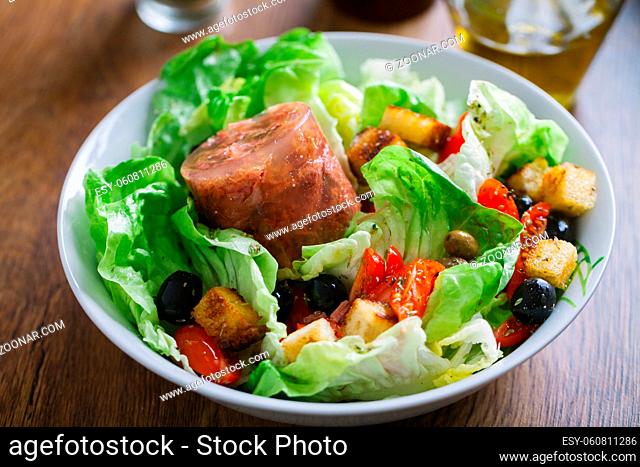 Fresh salad with black olives and tomato. High quality photo