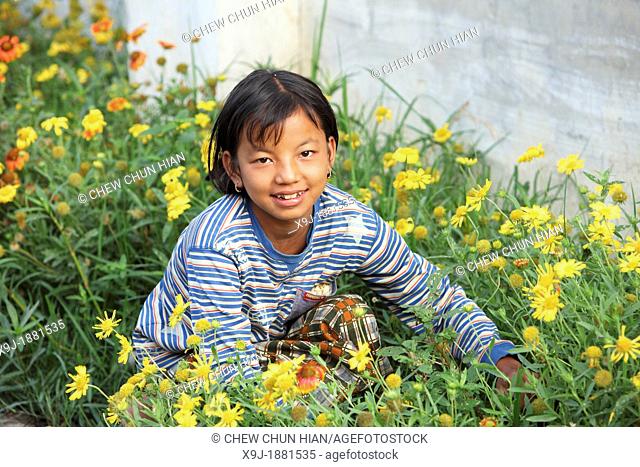 Cute little girl outdoors in the garden, Shan State, Myanmar, burma