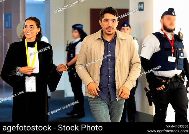 Lawyer Jetsun Serve and Accused Smail Farisi pictured after the judgment on the individual glass boxes in which the accused have to sit for the trial of the...