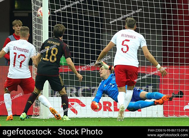 16 June 2023, Poland, Warschau: Soccer: Internationals, Poland - Germany, National Stadium. Germany's goalkeeper Marc-Andre ter Stegen (back) can't keep out...