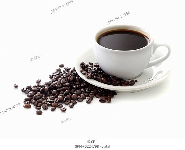 Black coffee in cup with beans