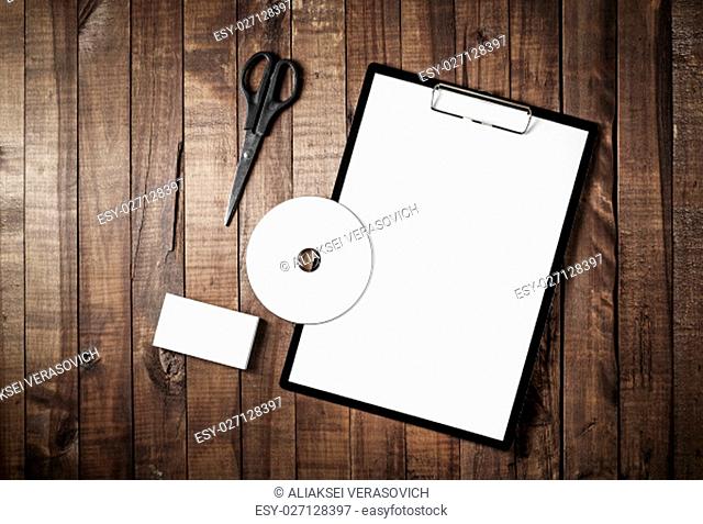 Blank branding identity template on vintage wooden table background. Photo of blank stationery. Mock up for design portfolios. Top view